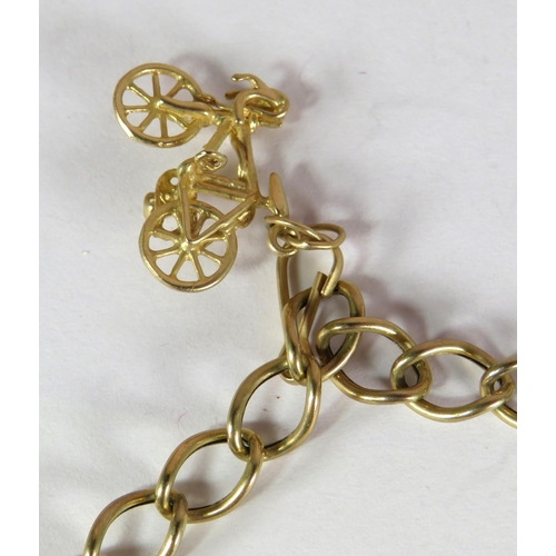 378 - 9ct Yellow Gold Charm Bracelet on a large link chain. Charms include St Christopher, Bicycle, Crucif... 