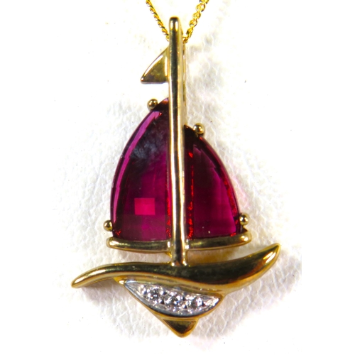 381 - 9ct Yellow Gold Pendant as a Ship with Ruby Sails and Diamond set Hull. Set on a 17 inch 9ct Chain. ... 