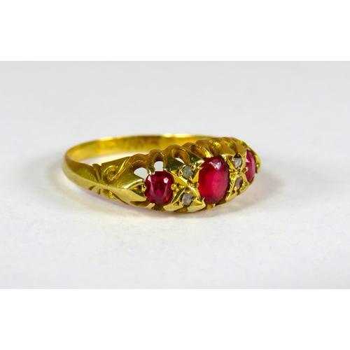 397 - 18ct Yellow Gold Gypsy Style Ring set with a Trio of Rubies.  Finger size 'K'   2.0g