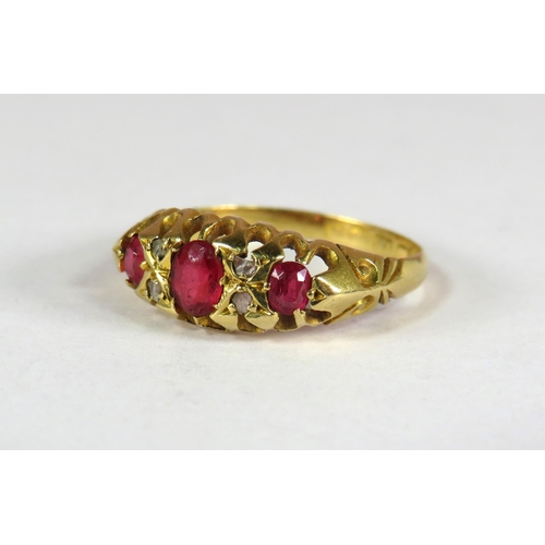 397 - 18ct Yellow Gold Gypsy Style Ring set with a Trio of Rubies.  Finger size 'K'   2.0g