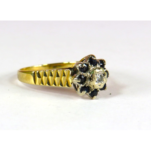 400 - 9ct Yellow Gold Ring set with a Small Central Diamond (3.5mm) surrounded by 8 small 2mm Sapphires. F... 