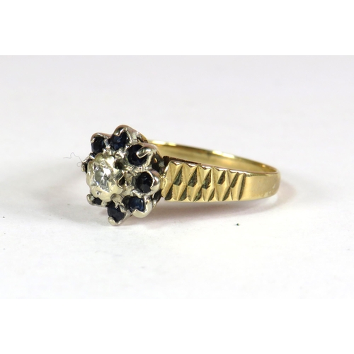 400 - 9ct Yellow Gold Ring set with a Small Central Diamond (3.5mm) surrounded by 8 small 2mm Sapphires. F... 