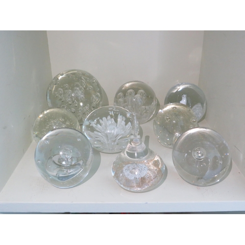 506 - Nine Clear art glass paperweights.