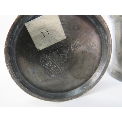 525 - Two antique Irish pewter Noggin measures.