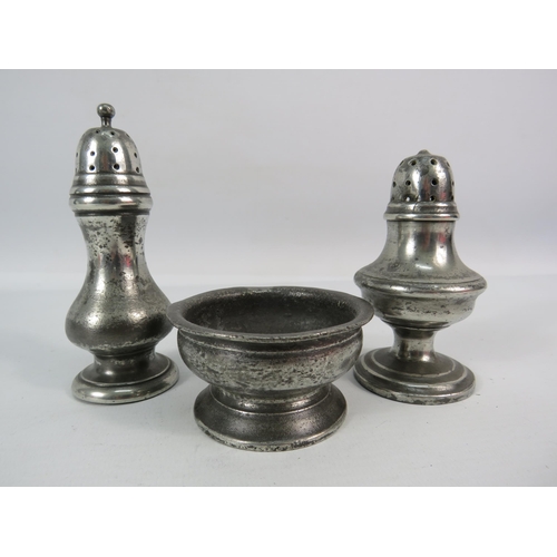 526 - Late 18th century pewter salt plus Two 19th century pepper pots.