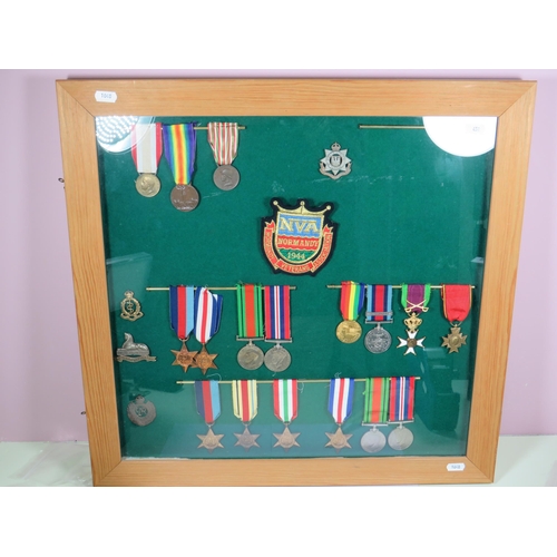 451 - Good collection of  WW2 Medals and Regimental Cap Badges. All Framed and Mounted under glass in Pine... 