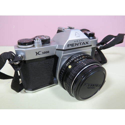 483 - Pentax K1000 with 50mm Lens plus leather carry case plus a Nikon SLR Camera with 50mm Lens. Also two... 