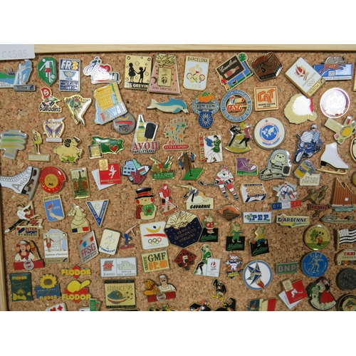 491 - Large Selection of assorted metal and enamel badges. All mounted on a Pine Framed Cork Board display... 