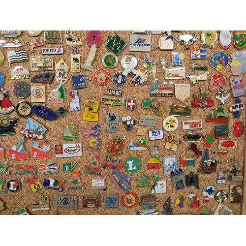 491 - Large Selection of assorted metal and enamel badges. All mounted on a Pine Framed Cork Board display... 