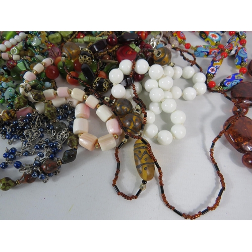 576 - Good selection of costume jewellery necklaces, Murano glass, rose quartz, faux amber etc.