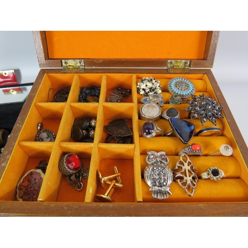 577 - 2 jewellery boxes containing a good selection of costume jewellery and a set of pompador pearls.