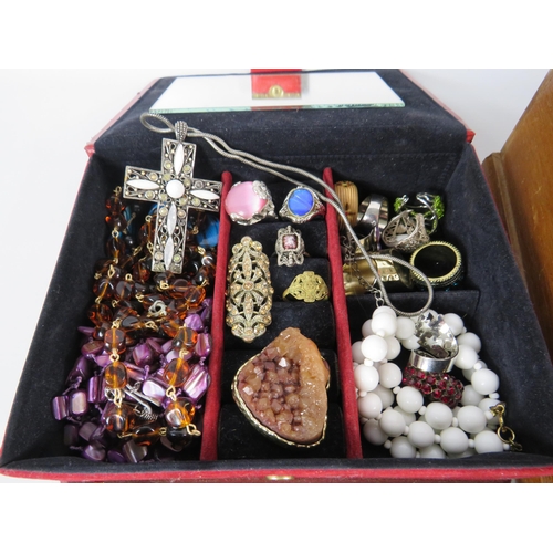 577 - 2 jewellery boxes containing a good selection of costume jewellery and a set of pompador pearls.