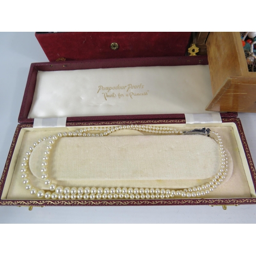 577 - 2 jewellery boxes containing a good selection of costume jewellery and a set of pompador pearls.