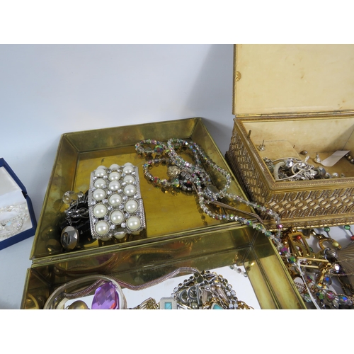 579 - 2 Jewellery with costume jewellery contents and a brass clothes brush.