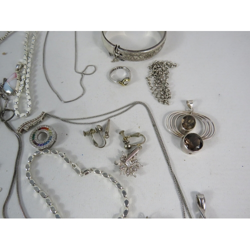 587 - Large selection of 925 silver and silver tone jewellery.