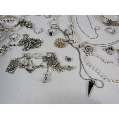 587 - Large selection of 925 silver and silver tone jewellery.