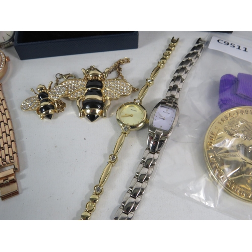 590 - Selection of Ladies quartz wristwatches, a torvill and dean medal etc.