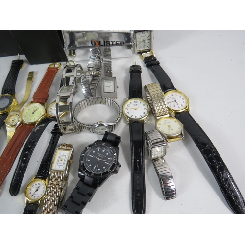 597 - Large selection of mens and ladies quartz wristwatches.