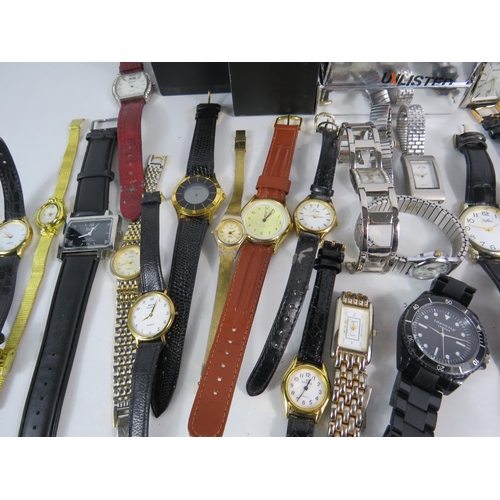 597 - Large selection of mens and ladies quartz wristwatches.