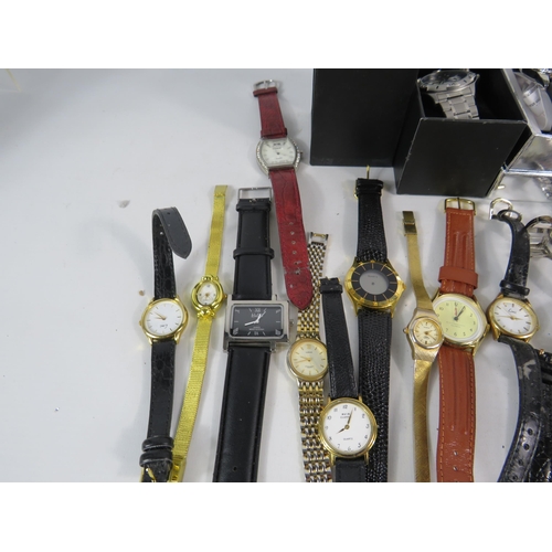 597 - Large selection of mens and ladies quartz wristwatches.