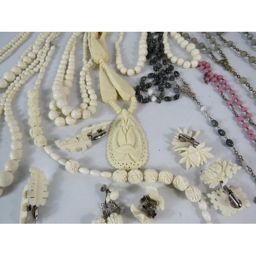 600 - Selection of bone carved jewellery and Rosary necklaces.