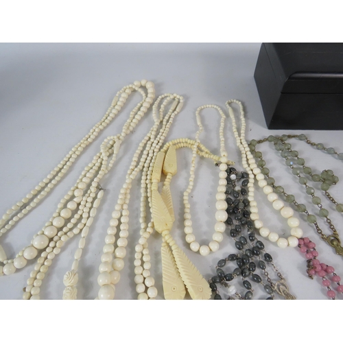 600 - Selection of bone carved jewellery and Rosary necklaces.