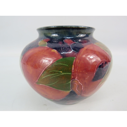 714 - Mid 20th century Moorcroft squat bulbous vase in the Pomegranate pattern signed to the base, 3.5