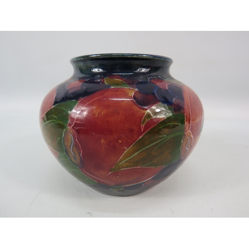 714 - Mid 20th century Moorcroft squat bulbous vase in the Pomegranate pattern signed to the base, 3.5