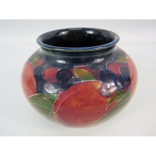 714 - Mid 20th century Moorcroft squat bulbous vase in the Pomegranate pattern signed to the base, 3.5