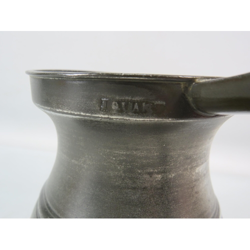 718 - English antique pewter bellied quart measure.