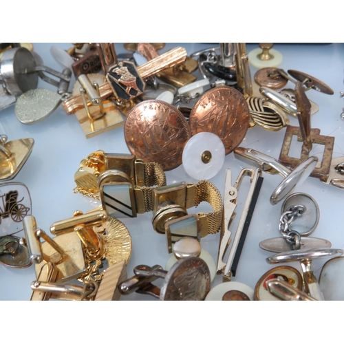 1195 - Large selection of vintage cuff links and tie clips.