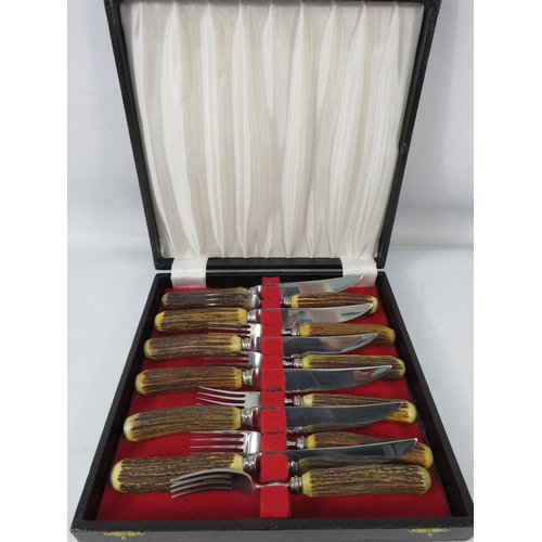 1200 - Set of Antler handle steak knives and forks.