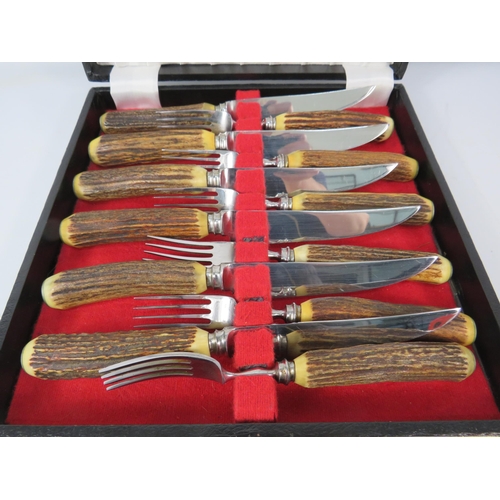 1200 - Set of Antler handle steak knives and forks.