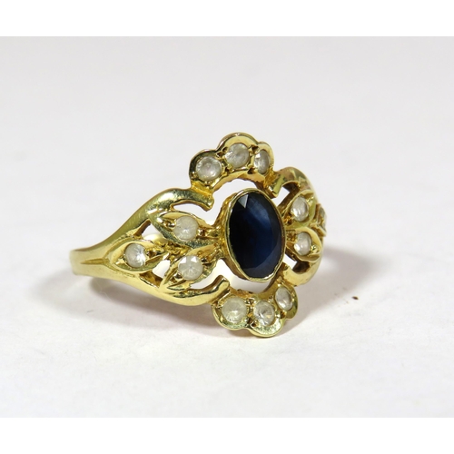 438 - 14ct yellow Gold Ring set with a Central Sapphire (6 x 4 mm) surrounded by 12 Small White Sapphires.... 