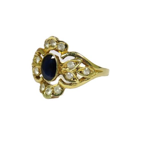 438 - 14ct yellow Gold Ring set with a Central Sapphire (6 x 4 mm) surrounded by 12 Small White Sapphires.... 