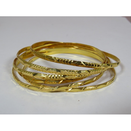 439 - Six Oriental Gold Bangles. Each marked 20ct.. 44.5g