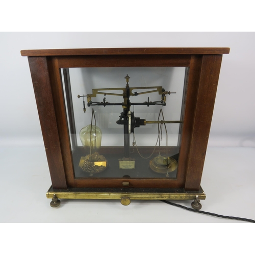 458 - Vintage Baird and Tatlock scientific scales in glass and wooden case converted to a lamp. 15.5