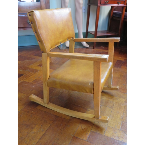 472 - Childs vintage leatherette rocking chair with brass studs detail. 22