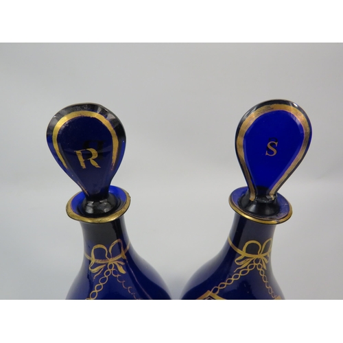 11 - Two antique bristol blue decanters, Rum and Shrub. Approx 9