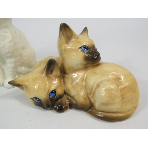 27 - Four Beswick cat figurines, the tallest stand 4