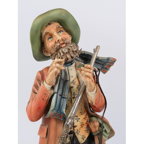 28 - Cortese Capodimonte figurine of a Hunter with his dog, 13