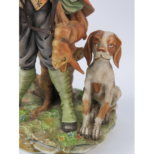 28 - Cortese Capodimonte figurine of a Hunter with his dog, 13