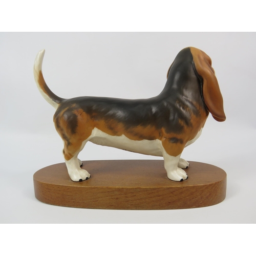 3 - Beswick Basset hound on a wooden base, matt finish.