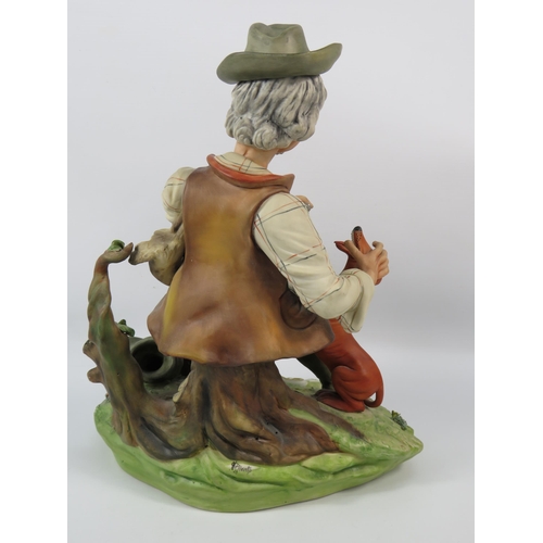 36 - A Giaretta Capodimonte game keeper figurine, 13