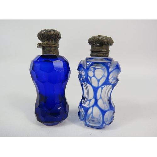 53 - Two antique scent bottles with sterling silver lids, Bristol blue and cut to clear.