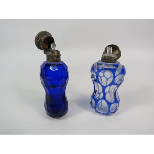 53 - Two antique scent bottles with sterling silver lids, Bristol blue and cut to clear.