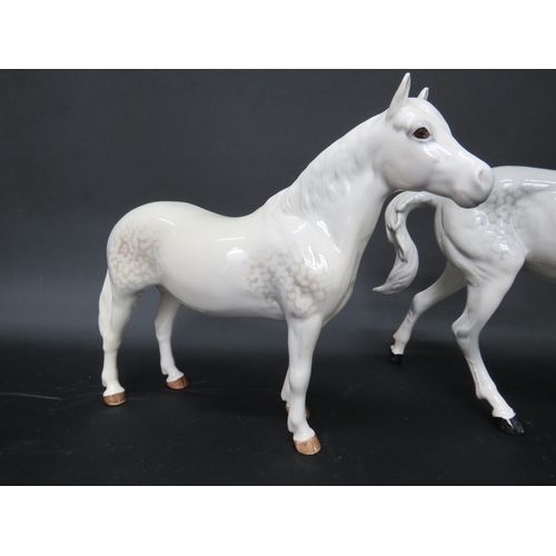 56 - Beswick Connamara and Spirit of Fire dapple grey horse figurines.