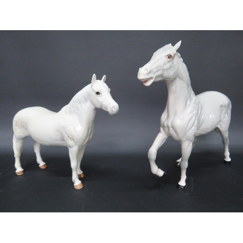 56 - Beswick Connamara and Spirit of Fire dapple grey horse figurines.