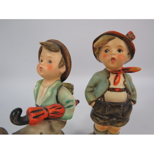 59 - Two Goebel hummel figurines the brother and Globe Trotter.