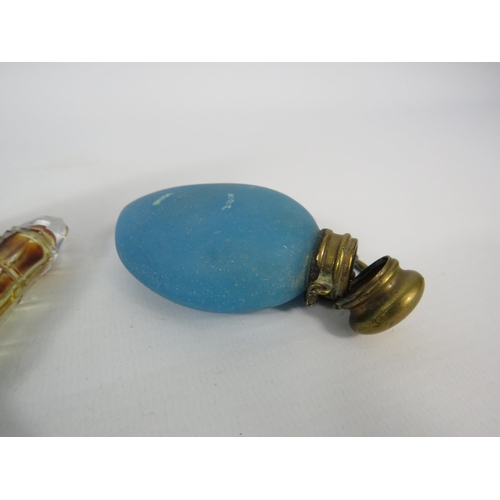 67 - Three antique glass scent bottles, one is missing its stopper and one requires a hinge pin repair.